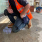 Tradegear Safety Kneepads on tradesperson kneeling on rough surface. 